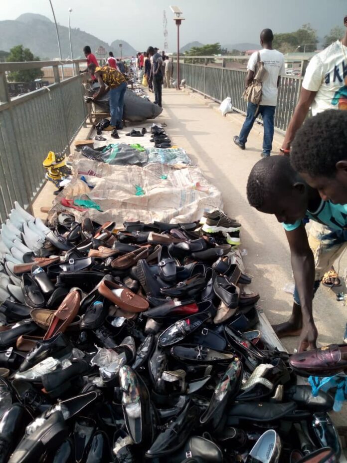 AEPB mum as pedestrian bridge turns market place in Abuja