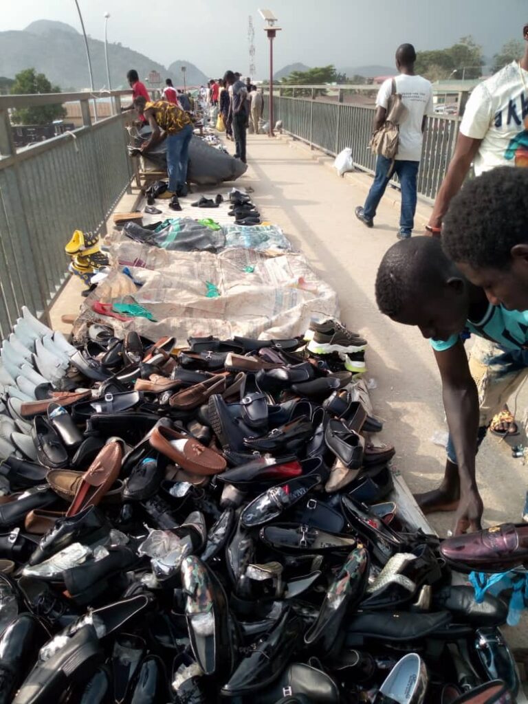 AEPB mum as pedestrian bridge turns market place in Abuja