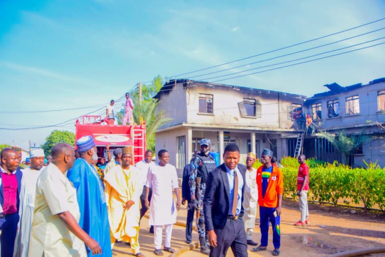 Ganduje commiserates with Police over fire incident, visits scene