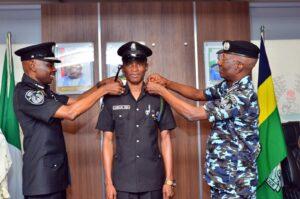 Father, son receive promotions on same day