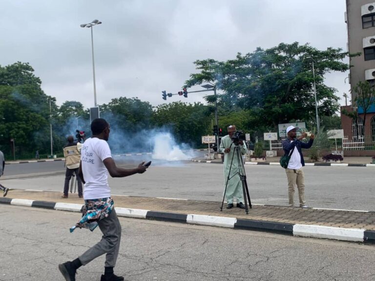 Pro-government protesters storm Abuja stadium in 12 buses