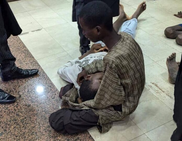 Judge flees as malnourished minors detained over #EndBadGovernance protest collapse in court (Video)