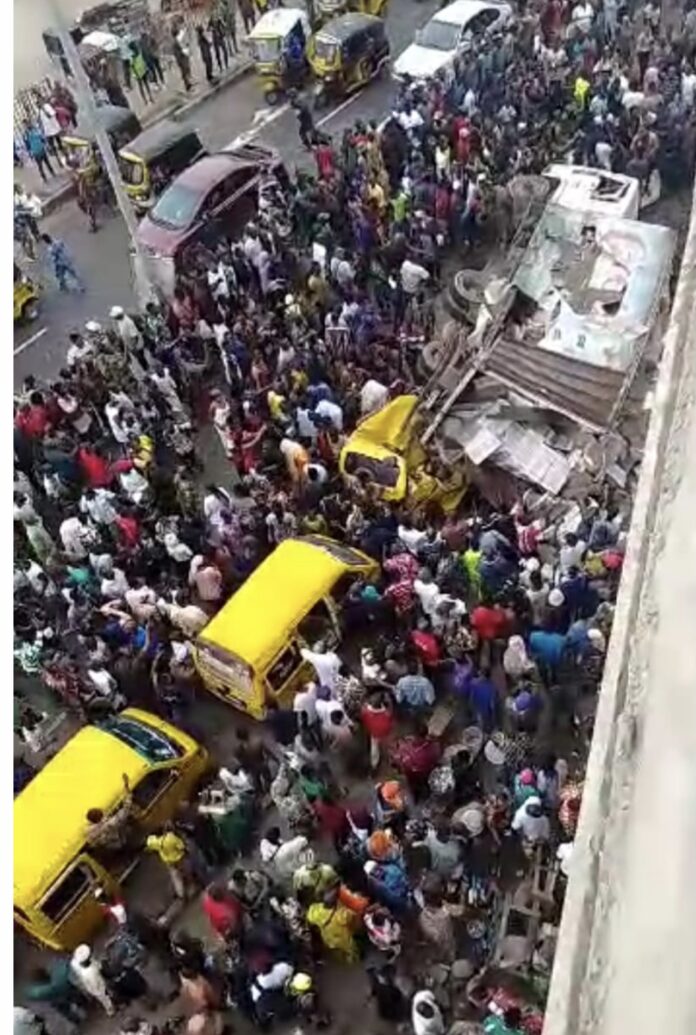 Driver severely injured as truck falls off bridge in Lagos