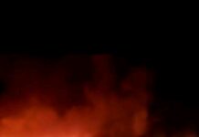 Fire engulfs residential building after transmission line falls